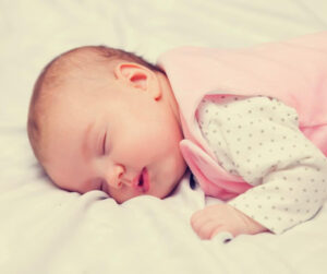 best sleeping position for gassy baby