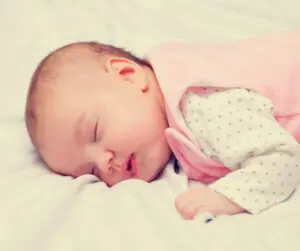 best sleeping position for gassy baby